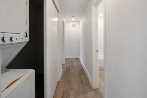 a small laundry room with a washer and dryer