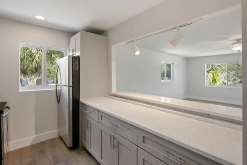 a kitchen with a counter top and a refrigerator