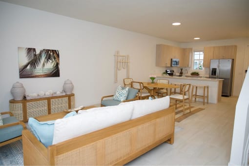 A living room and dining room with a couch and a table