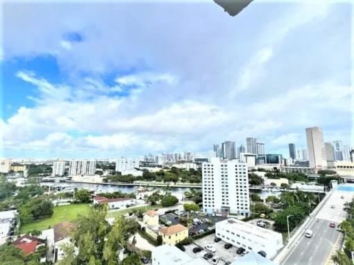the view of the city from the balcony of a building