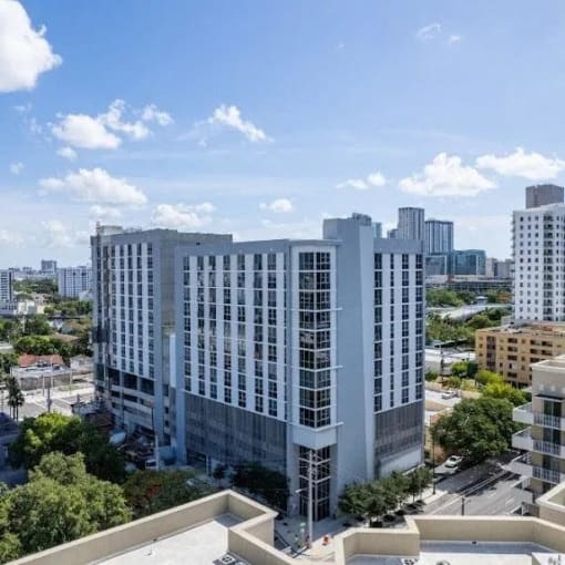 a tall building with a city in the background