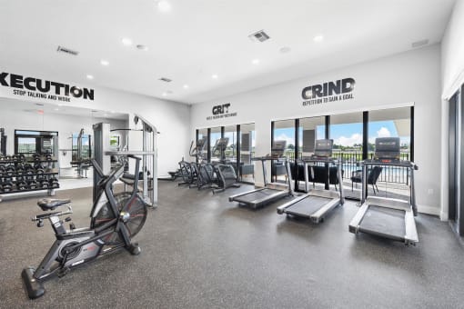 the gym with cardio equipment at the apartments
