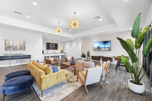a living room with couches and chairs and a fireplace