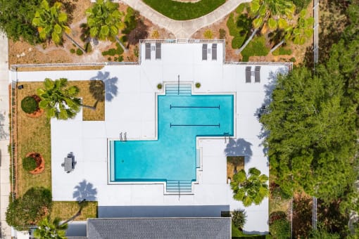 arial view of a pool on the roof of a house