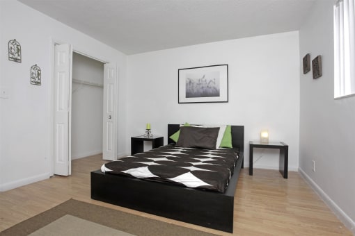 a bedroom with a bed and a window and a closet