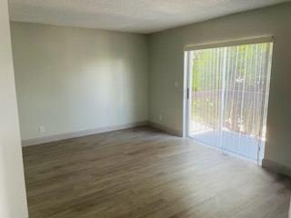 an empty living room with a sliding glass door