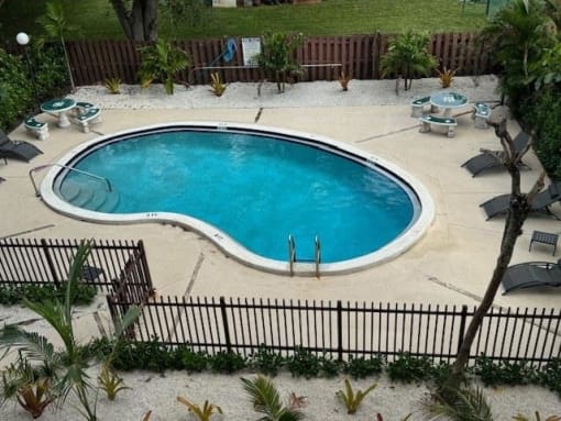 a large pool of water in the middle of a yard