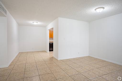A room with white walls and a tiled floor.