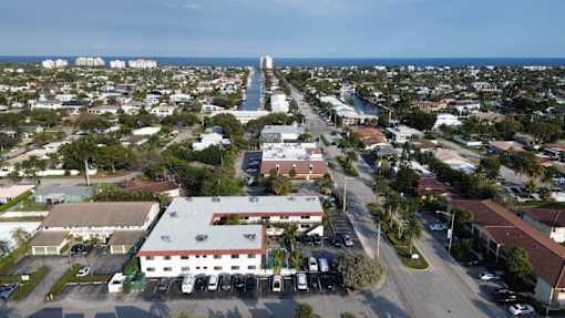 A view of a city with a large building in the center.