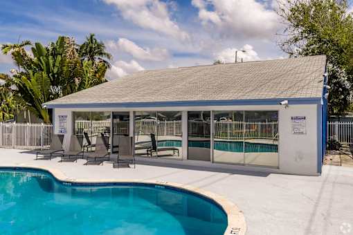 A pool with a building next to it.