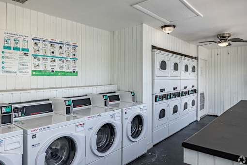 A row of washing machines in a laundromat.