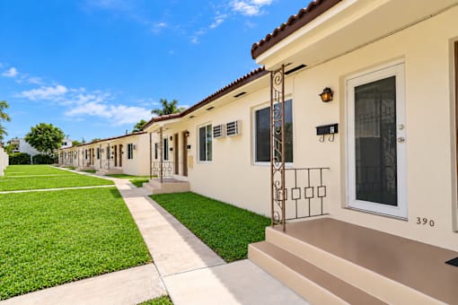 A row of houses with number 390 on the front door.