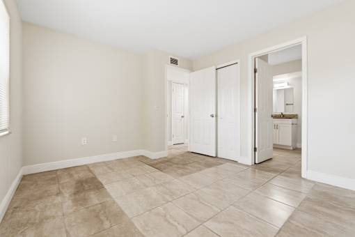 A room with a tile floor and white walls.