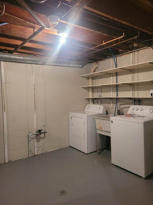 A laundry room with a washer and dryer.