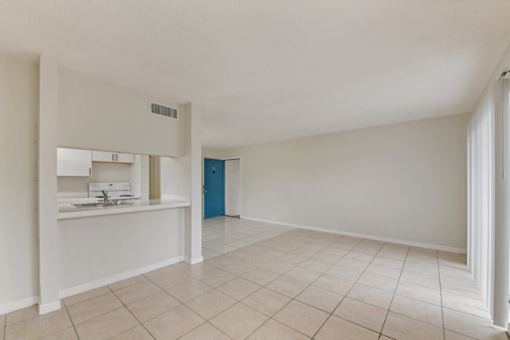 A room with a blue door and a white wall.