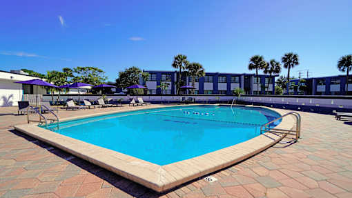 A rectangular pool with a brick border.