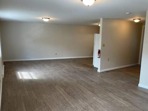 A room with a fire extinguisher on the wall.