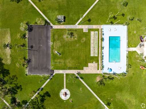 a birds eye view of a basketball court with a blue pool