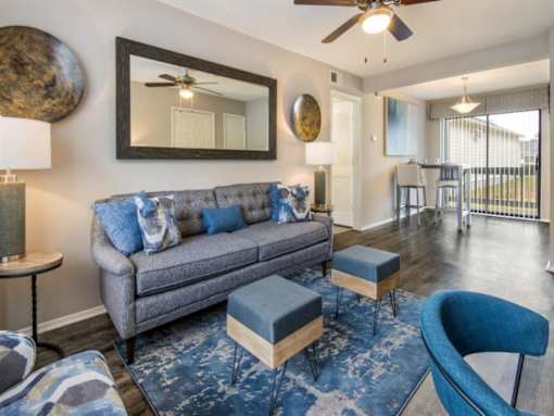 a living room with a couch and a mirror