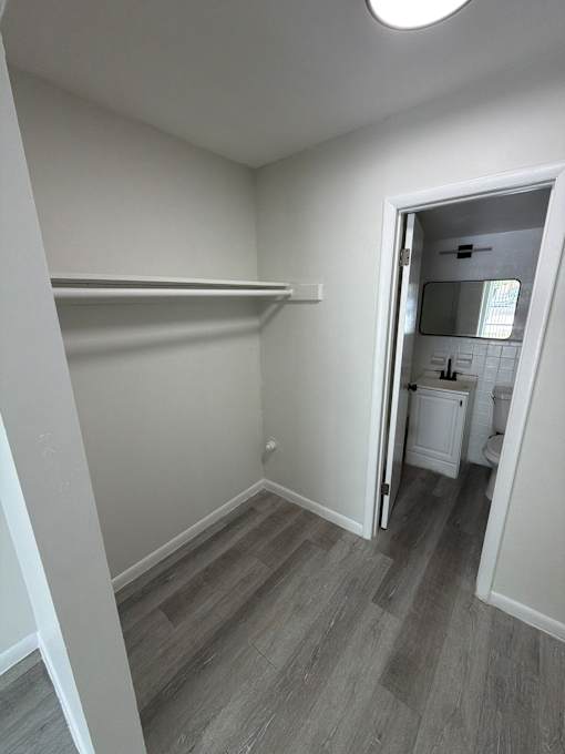 A small white bathroom with a toilet and sink.