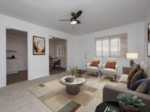 a living room with white walls and a ceiling fan