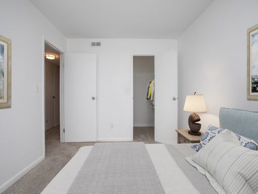 a bedroom with a bed and a closet
