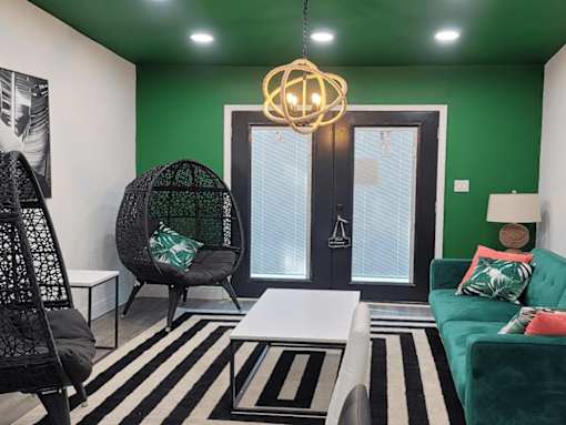 a room with a wall that has a geometric design on it