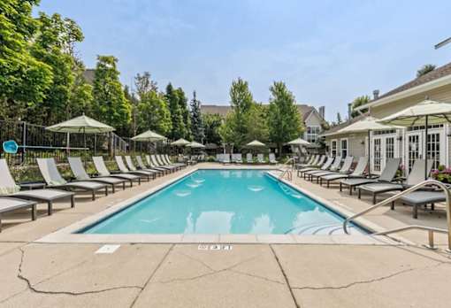 Swimming Pool And Relaxing Area at Encore Townhomes, Utica, MI