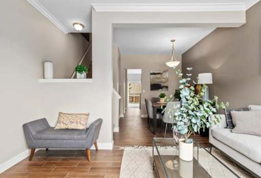 Spacious Living Room With Private Balcony at Encore Townhomes, Utica, MI