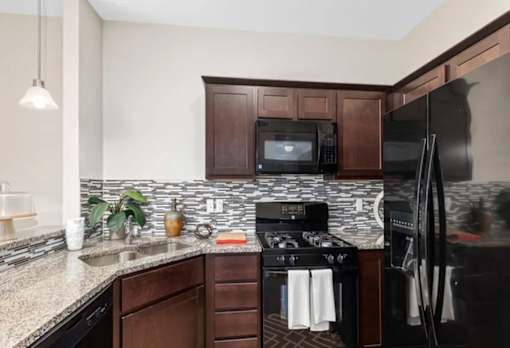Updated Kitchen With Black Appliances at Encore Townhomes, Michigan , 48315