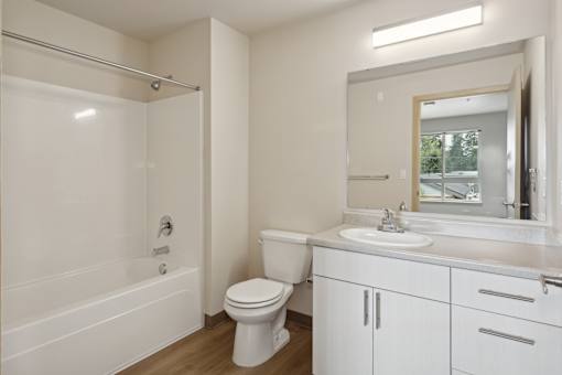a bathroom with a sink toilet and a bath tub