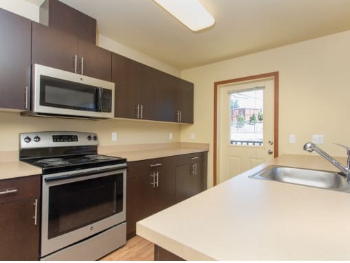 Fully Equipped Kitchen with Refrigerator, Microwave, Dishwasher