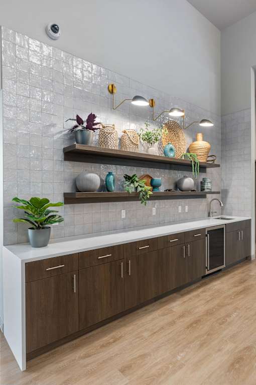 A kitchen with wooden cabinets and a white countertop.
