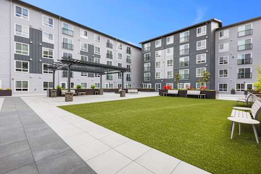 Lawn and outdoor seating area at Ovation at Paine Field in Everett, WA