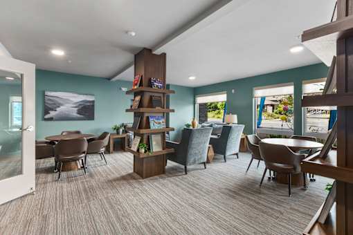 A room with a carpeted floor and a white ceiling with a skylight.