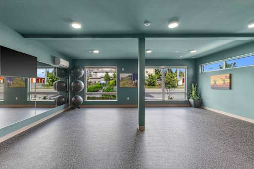 Yoga Studio with large windows and mirrors at Ovation at Paine Field