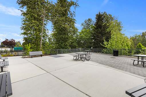 Park-style picnic tables and benches at Ovation at Paine Field