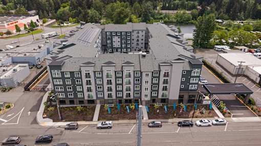 Exterior and parking at Ovation at Paine Field apartments in Everett, WA