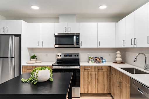 Kitchen with Black Appliances at Solera Apartments, Renton, 98056