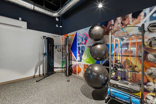 Fitness center with cardio equipment at Kendrick Landing Apartments in Lakewood, WA