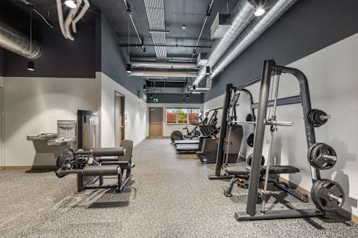 Apartment fitness center with strength training equipment at Kendrick Landing Apartments