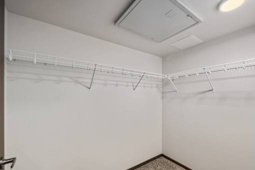 Walk-in closet inside a model apartment at Kendrick Landing Apartments