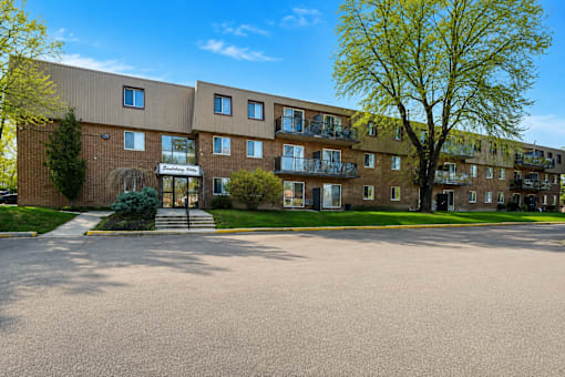 A large building with a tree in front of it.