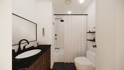 A bathroom with a sink, toilet, and shower.