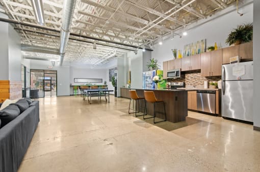 a living room with a kitchen and a dining room