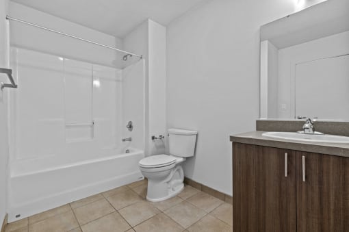 a bathroom with a toilet sink and a shower
