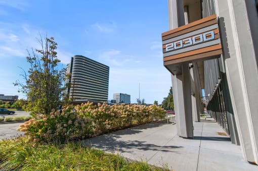 a view of a building with plants on the side of it