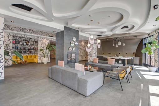 a rendering of a lobby with couches and a table