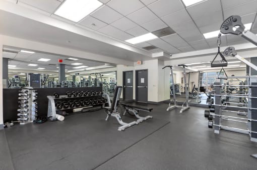 the weights room in the fitness center at the boulevard apartments in