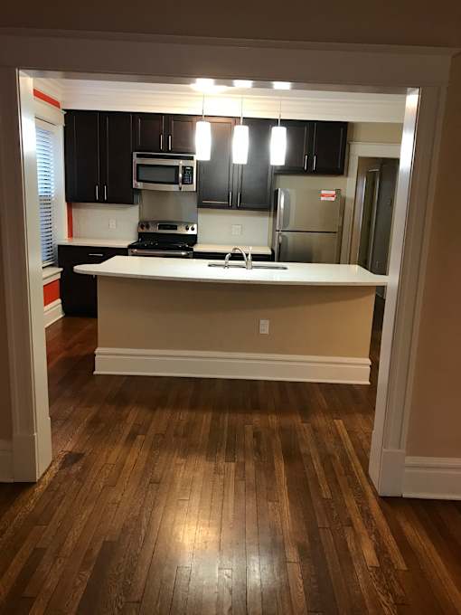 a view of a kitchen from the living room